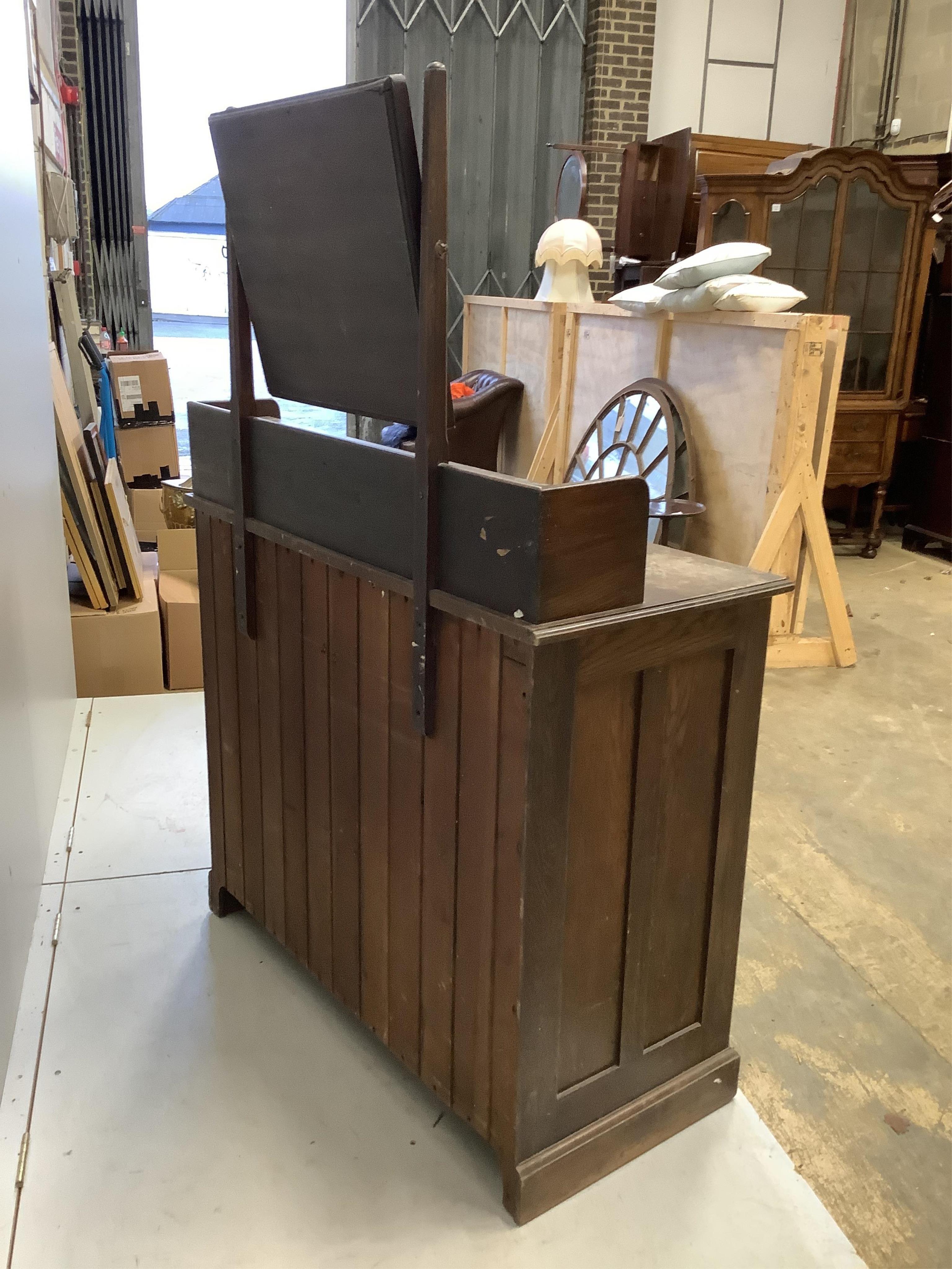 An early 20th century oak dressing chest, width 107cm, depth 49cm, height 155cm. Condition - poor